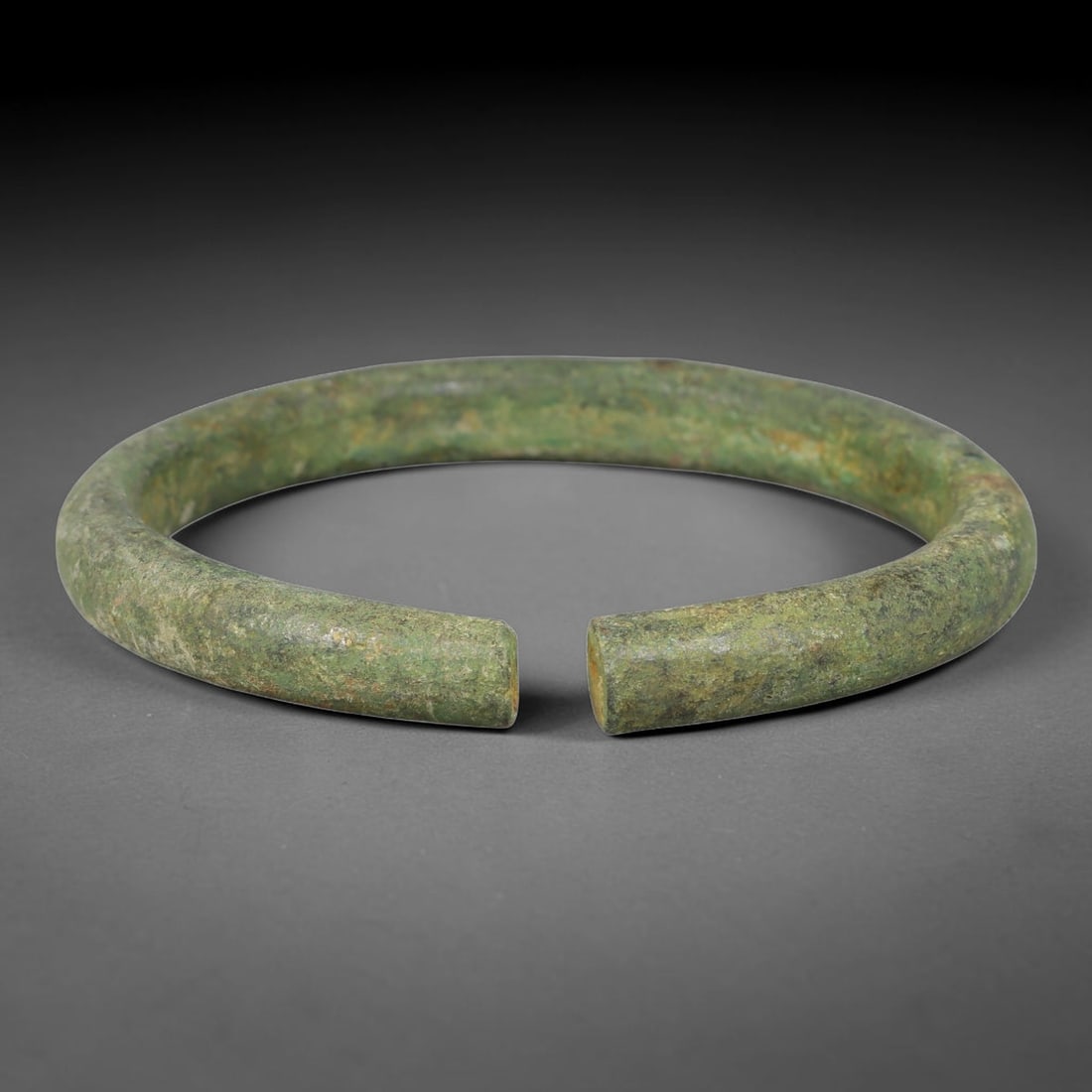 Ancient Roman Republic & Imperial Roman Bronze Open Armilla Bracelet (509 BCE-476 CE), 97AT: This antique solid bronze open cuff armilla bracelet originates from Roman Republic & Imperial Roman Culture, widely produced utilitarian and symbolic adornment worn by civilian women and awarded as m