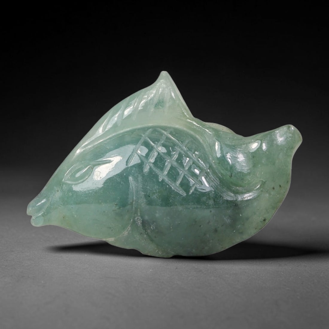 Natural Burmese Type A Jadeite Jade Hand Carved Pendant, 19BQ: Artisan hand-carved untreated Burmese Type A jadeite jade pendant measuring 29x19 mm. Carefully sculpted with detailed relief craftsmanship and finished with a smooth glossy polish. Authentic Type A j