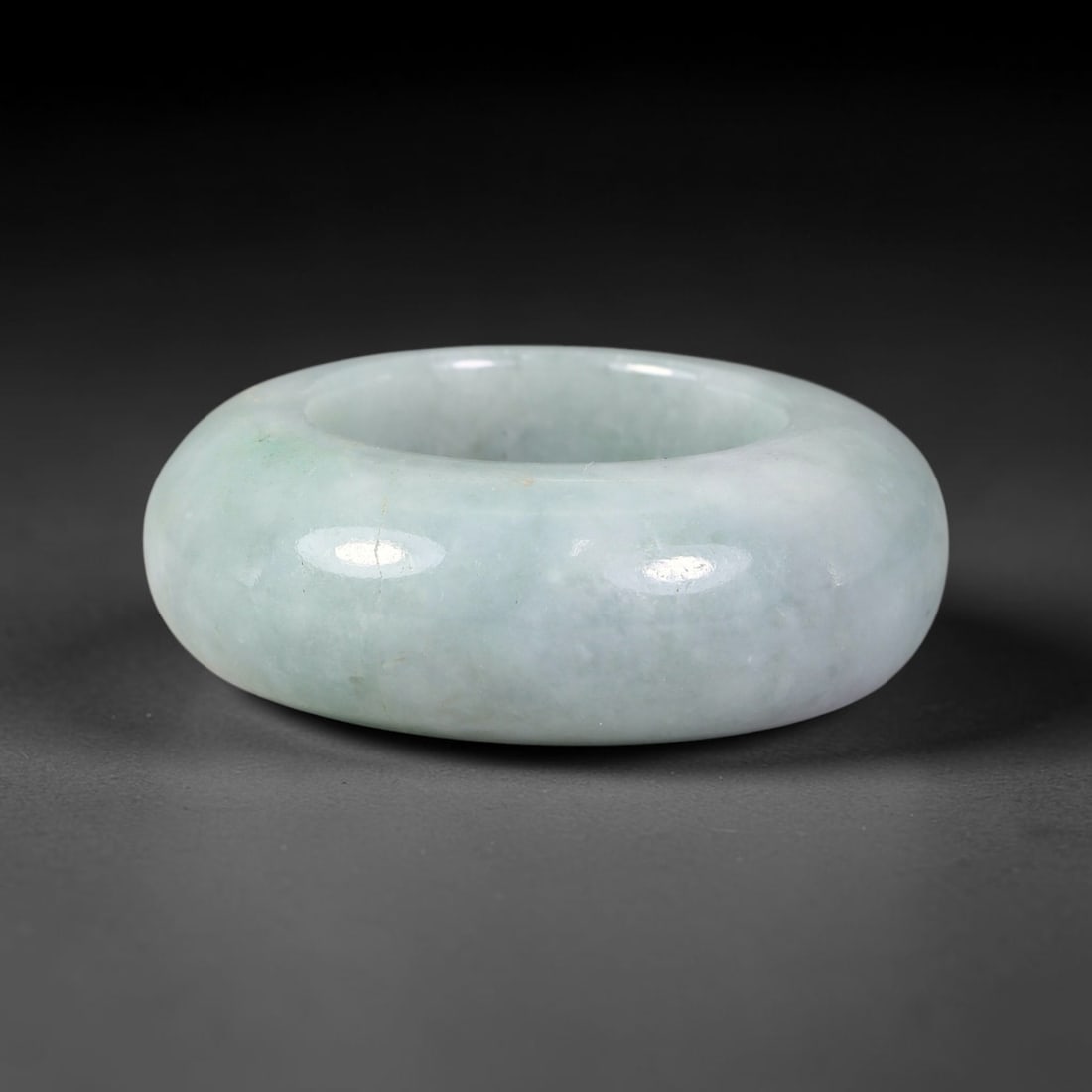 Natural Burmese Type A Jadeite Jade Wide Band Ring, 5BK: Polished untreated Burmese Type A jadeite jade wide band ring, US ring size 13 with a substantial band width of 13 mm. The jadeite features a soft pale mint green base naturally streaked with flowing 