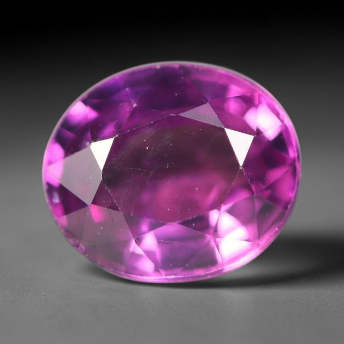 1.90ct Natural Tanzanian Rhodolite Grape Garnet Faceted Loose Gemstone, 51BA: This expertly faceted grape garnet, a scarce saturated purple-magenta rhodolite variant, features transparent crystal structure dotted with faint microscopic mineral specks within its precisely cut re