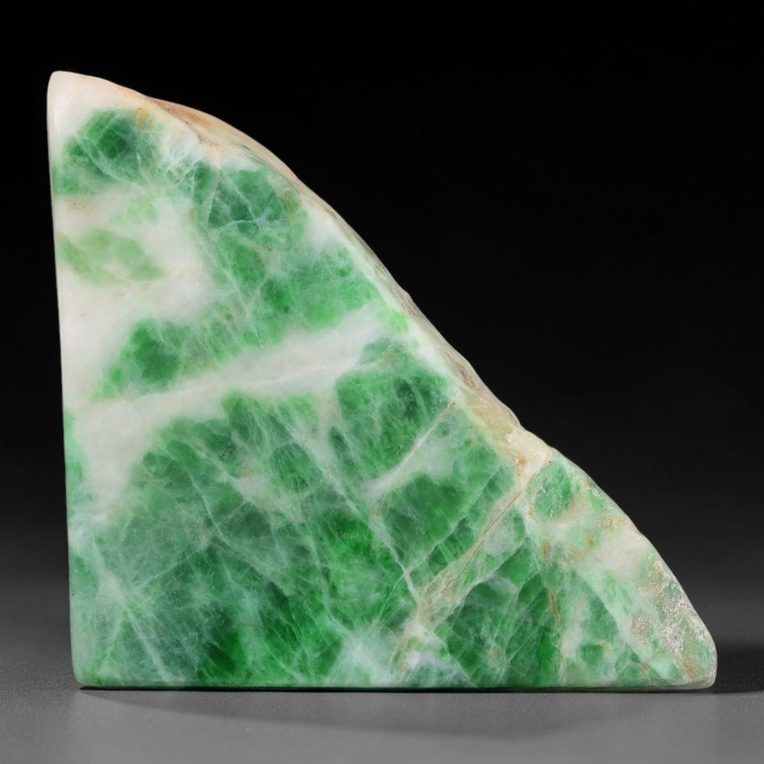 108ct Natural Type A Burmese Jadeite Jade Sliced Rough, 21FB: This specimen is a sliced rough block of natural Type A Burmese jadeite jade. The interior displays natural colour zoning with visible mineral veining and crystalline patterns typical of unprocessed j