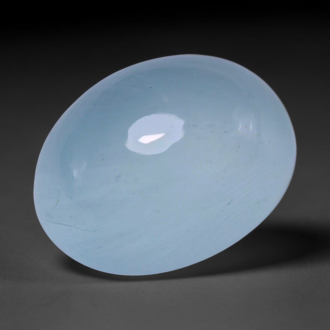 16.46ct Natural Nigerian Aquamarine Oval Cabochon Loose Gemstone, 52BY: This elegantly polished oval cabochon is natural aquamarine sourced from Nigeria. It features soft tranquil pale blue colour with subtle even tone distribution throughout the translucent crystal. The 