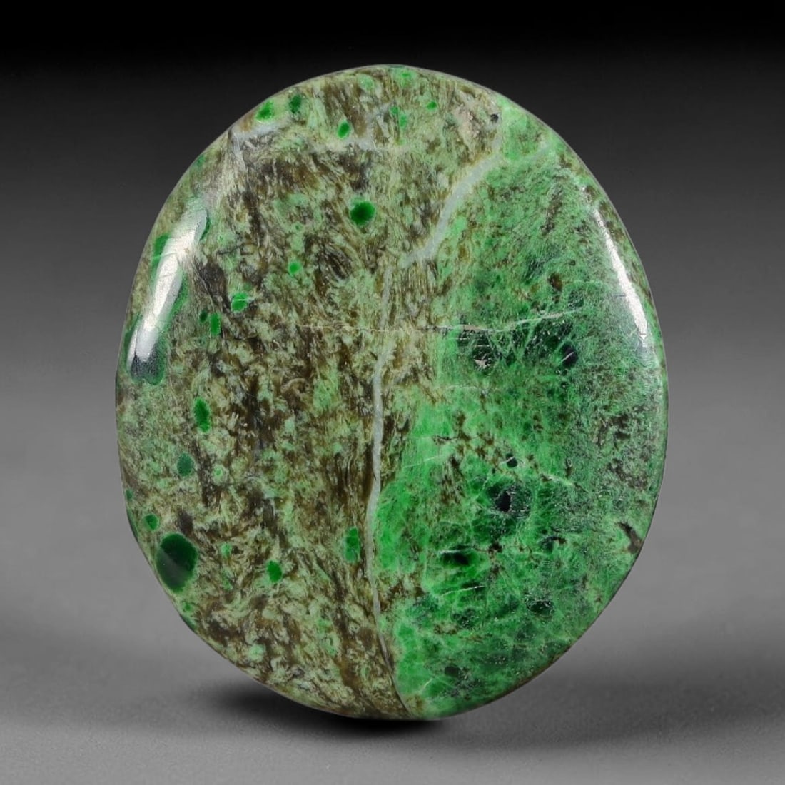 13.82ct Natural Burmese Type A Green Dot Scenic Matrix Jadeite Jade Cabochon, 25FA: This single untreated natural Burmese Type A oval jadeite jade cabochon weighs 13.82ct and measures 24.4x20.4x3.5mm. The stone features an earthy brown host matrix dotted with vivid round green spots,