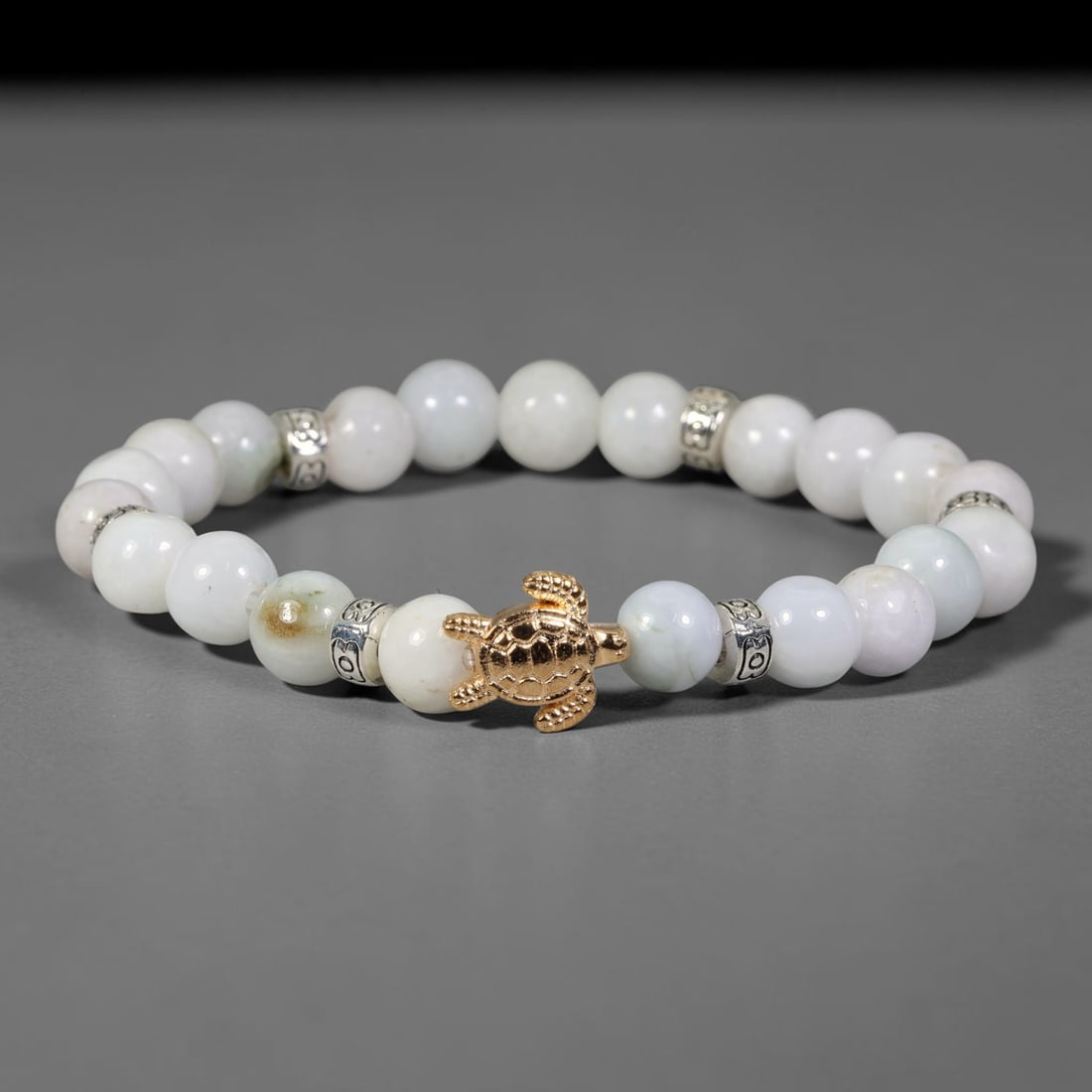 Natural Burmese Type A Jadeite Jade Beaded Bracelet, 10FJ: Made with polished natural jadeite jade round beads featuring soft pale natural tones. Each bead measures 9mm, strung as a flexible stretch bracelet. A minimalist elegant design ideal for daily wear, 