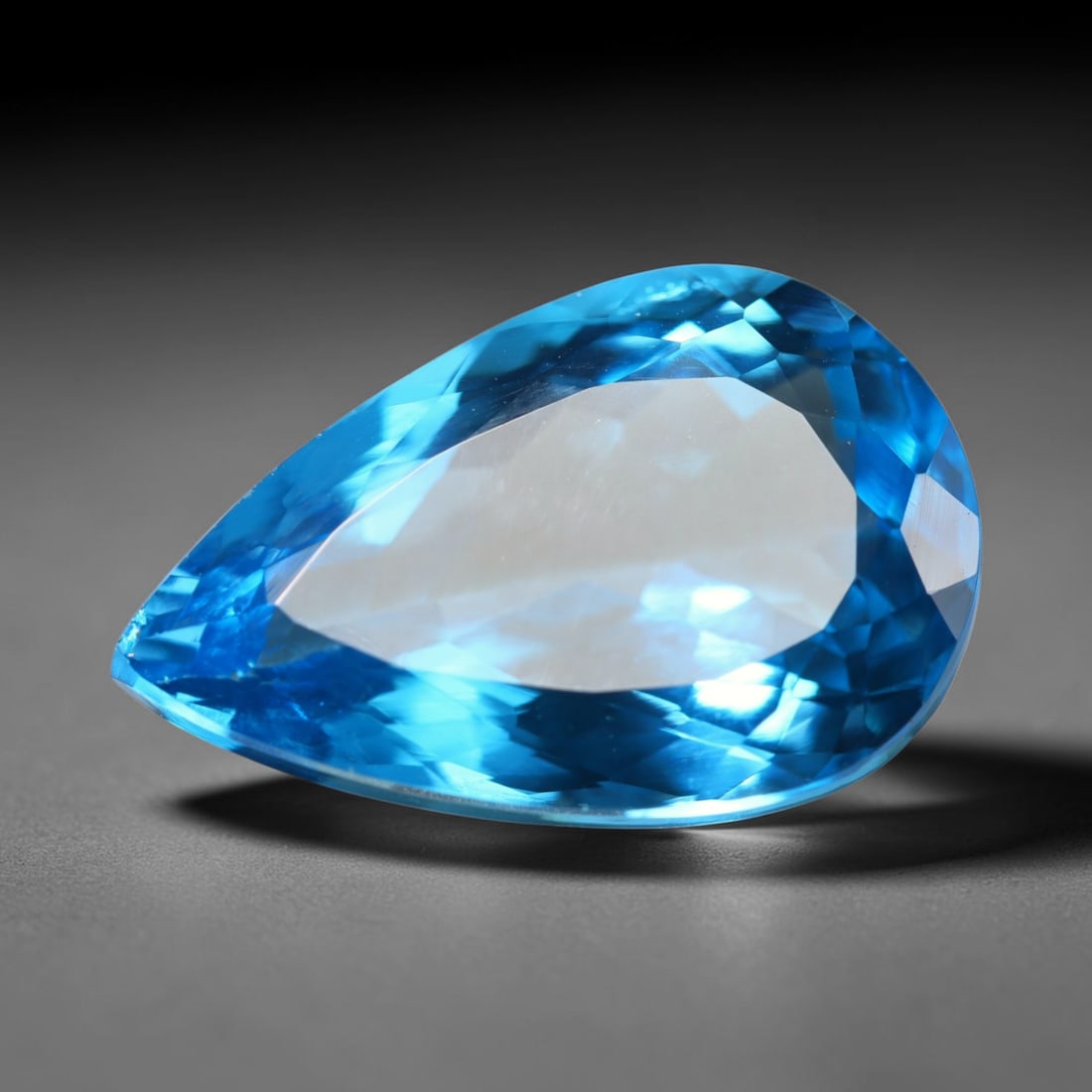 17.54ct Natural Brazilian London Blue Topaz Oval Faceted Loose Gemstone, 98BZ: This precisely cut oval faceted gemstone is natural London Blue Topaz originating from Brazil. The stone showcases an intense, rich deep royal blue hue, complemented by crisp, symmetrical faceting tha