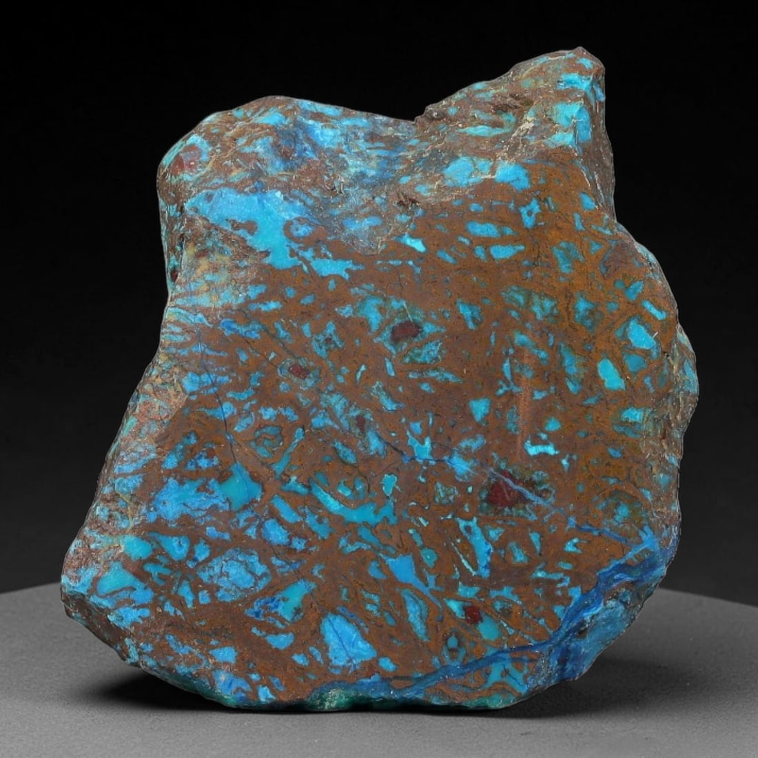 60ct Natural Peruvian Chrysocolla Polished Slab Rough, 76AR: This partial-polished chrysocolla slab features blended mineral matrix with smooth refined face and unaltered natural rugged edge across its 32x29x5mm elongated form, translucent mineral layers hold s