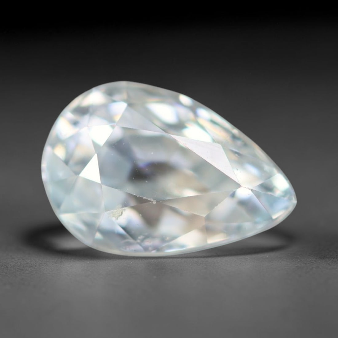 2.09ct Natural Cambodian White Zircon Loose Gemstone, 21BA: This fully polished Cambodian white zircon displays a crisp colorless transparent crystal body with faint microscopic mineral specks scattered within its high-refraction interior, measured at calibrat