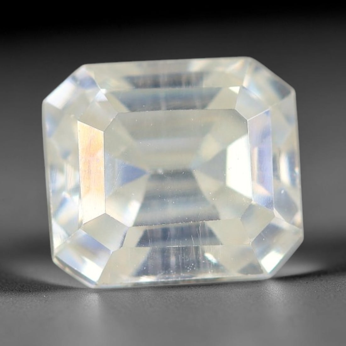 1.46 Carats Natural Cool White Moissanite Loose Gemstone, 93FM: This cool white moissanite holds dimension measurements of 6.8x6x4mm, delivering exceptional light dispersion that generates vivid rainbow sparkle across its fully transparent body, with faint microsc