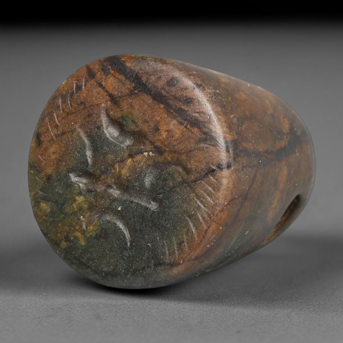 Ancient Sasanian Persian Conoid Stamp Seal (224-651 CE), 84EC: This antique variegated dark stone conoid stamp seal originates from the Sasanian Persian Empire, widely produced as wearable portable glyptic talismans for personal authentication and spiritual prote