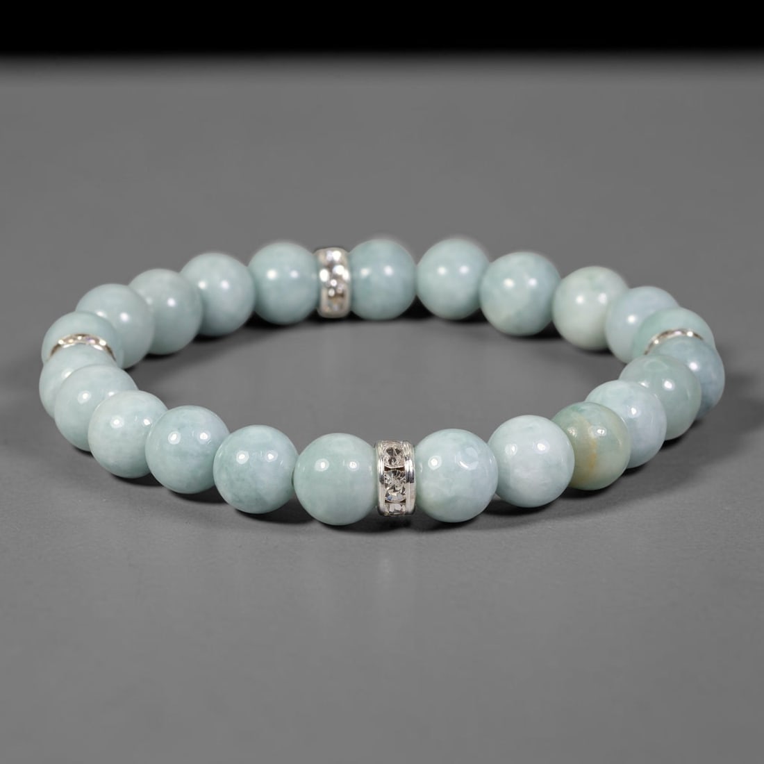 Natural Burmese Type A Jadeite Jade Beaded Bracelet, 21FJ: Constructed from polished natural jadeite jade round beads paired with decorative accent elements. The bracelet measures 8cm, assembled as a flexible wearable strand. Simple and elegant, suitable for 