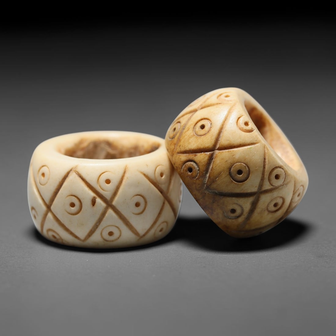 Antique Sino-Siberian Steppe Nomadic Craft Stag Antler Carved Bead Pair (Post 1850s), 44FV: Pair of beads skillfully carved from natural stag antler, originating from Sino-Siberian Steppe Nomadic craft traditions, produced post 1850s. The antler material holds attractive natural aged patina,