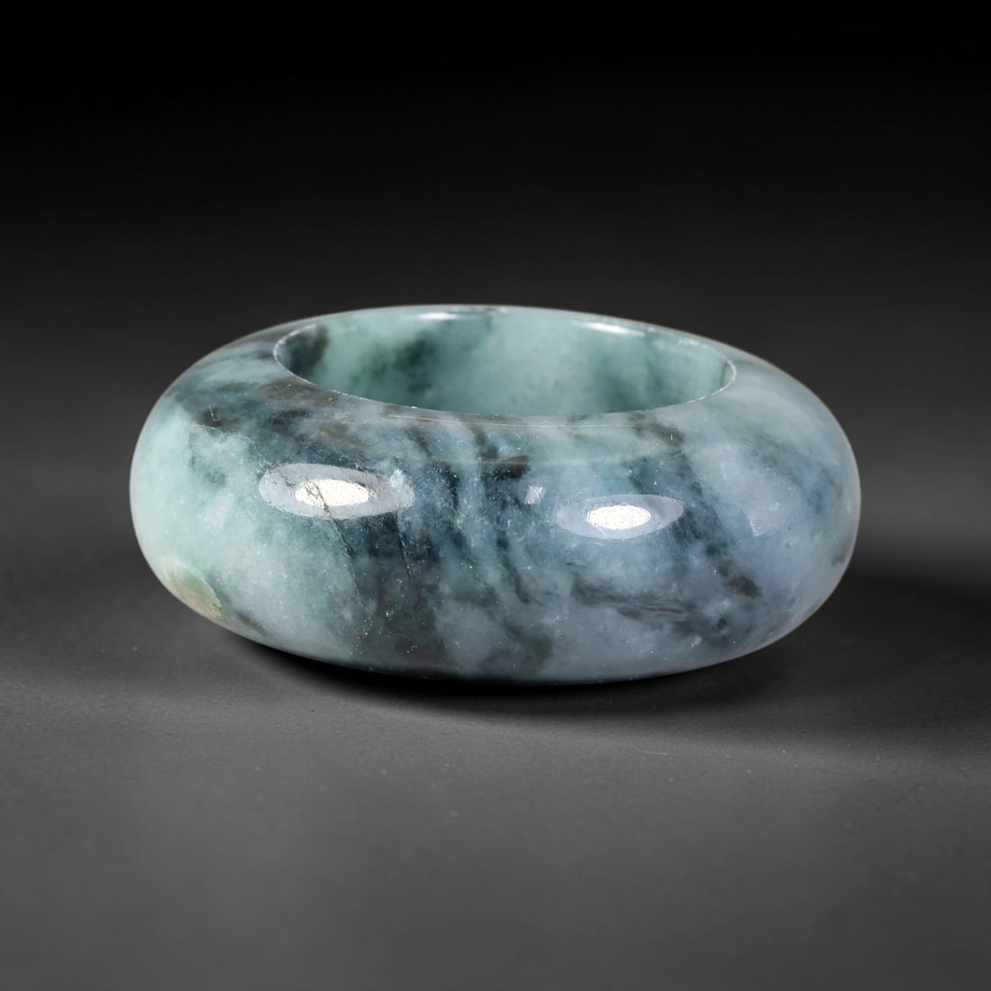 Natural Burmese Type A Jadeite Jade Wide Band Ring, 20BK: Polished untreated Burmese Type A jadeite jade wide band ring, US ring size 13 with a substantial band width of 13 mm. The jadeite features a soft pale mint green base naturally streaked with flowing 