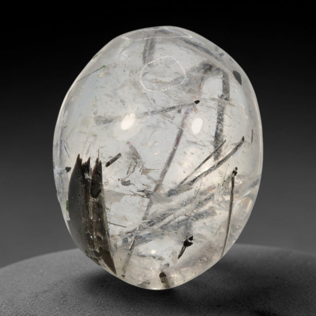 11ct Natural Brazilian Black Rutile Quartz Cabochon Loose Gemstone, 49BM: This polished cabochon of natural rutile quartz features countless distinct slender black rutile needle inclusions suspended within the clear quartz host crystal. The smooth domed surface enables full
