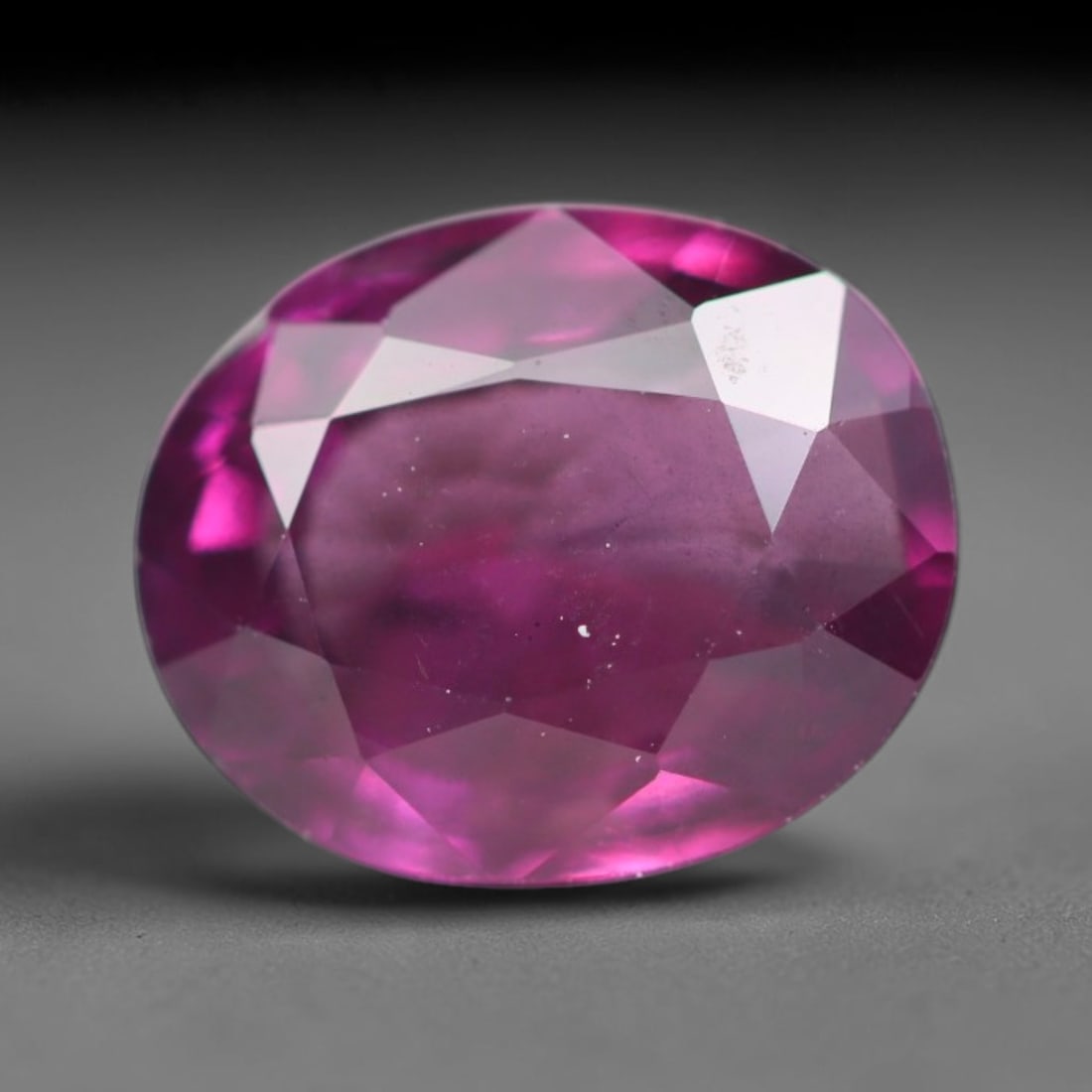 1.86ct Natural Tanzanian Rhodolite Grape Garnet Faceted Loose Gemstone, 95BA: This expertly faceted grape garnet, a scarce saturated purple-magenta rhodolite variant, features transparent crystal structure dotted with faint microscopic mineral specks within its precisely cut re