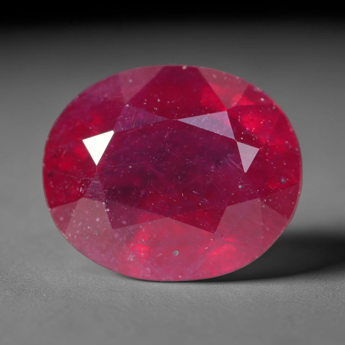 5.34ct Natural Madagascar Vivid Magenta Red Ruby Loose Gemstone, 43BA: This vivid magenta-hued Madagascar ruby boasts rich saturated red-pink saturation scattered with tiny fine mineral specks and distinct two-phase fluid bubble inclusions throughout its translucent crys