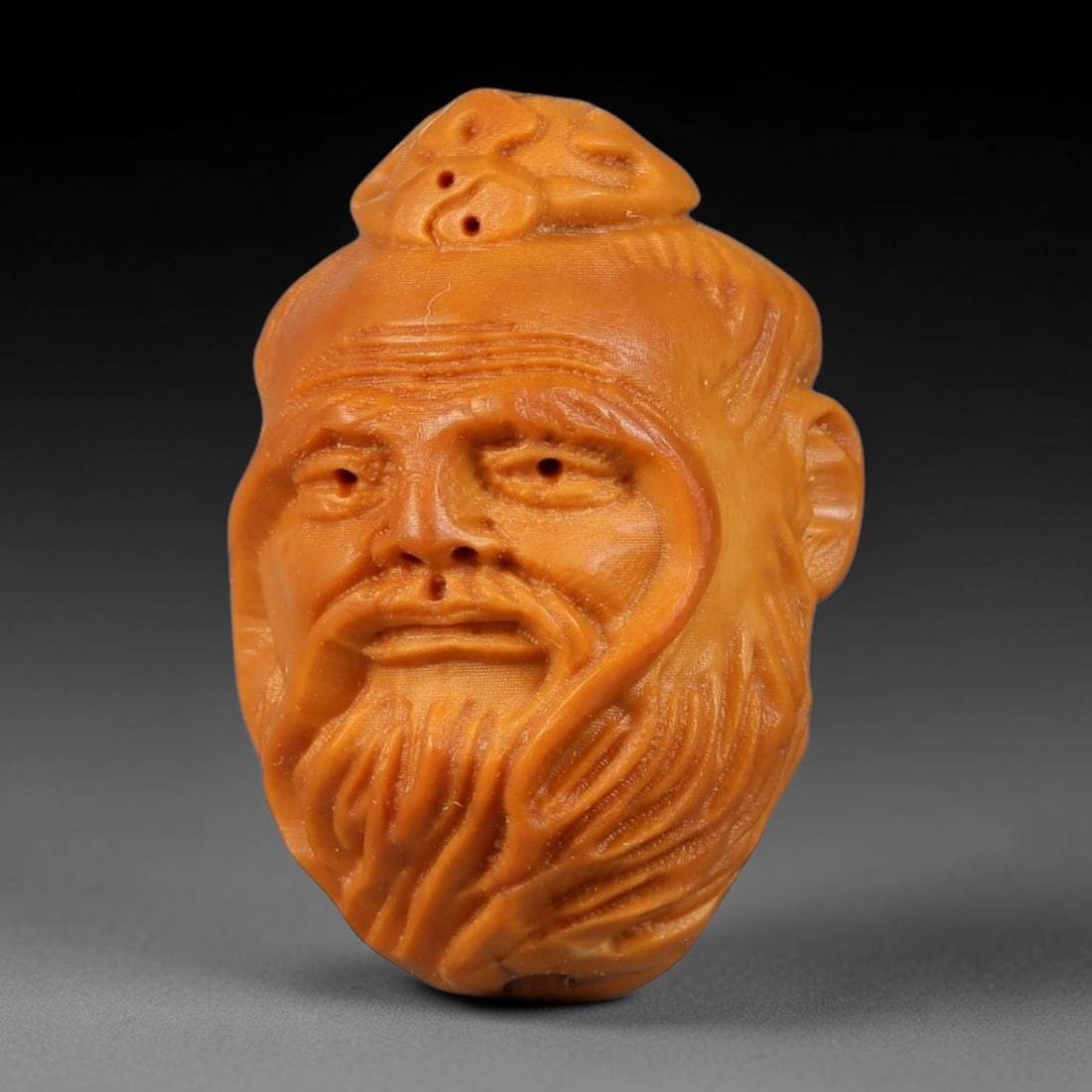 A Chinese Carved Natural Olive Nut Drilled Art Bead, 39BZ: Traditional craft bead carved from solid natural olive nut core, representing a classic miniature Chinese micro-carving folk art piece with a pre-drilled suspension bore integrated for easy threading 