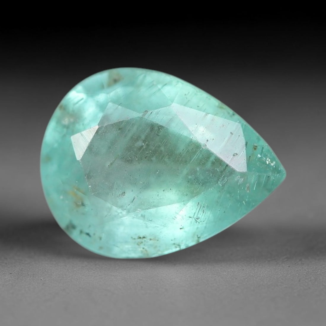 1.48 Carats Natural Zambian Green Emerald Loose Gemstone, 8FP: This green Zambian emerald holds smooth even saturation with subtle faint natural internal markings lending authentic organic character, measured at 8.8x6.8x4.1mm, its calm cool green tone delivers un
