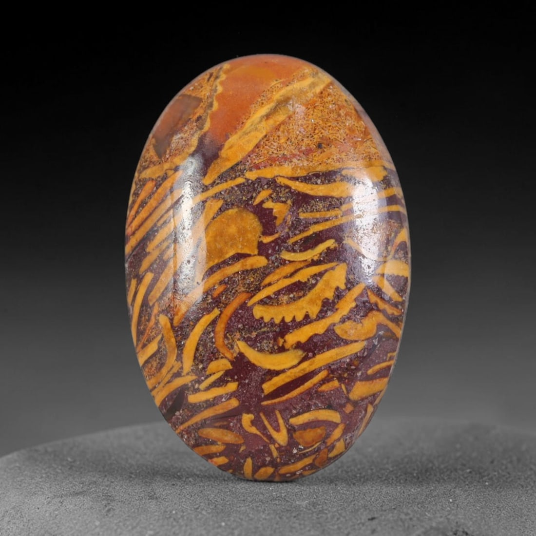 9.55ct Natural Mariam Jasper (Calligraphy Stone) Cabochon Loose Gemstone, 14AK: This fully polished Mariam Jasper, widely referred to as Calligraphy Stone, features deep plum base matrix interlaced with intricate golden ochre fossilized mineral veining that creates natural brushs