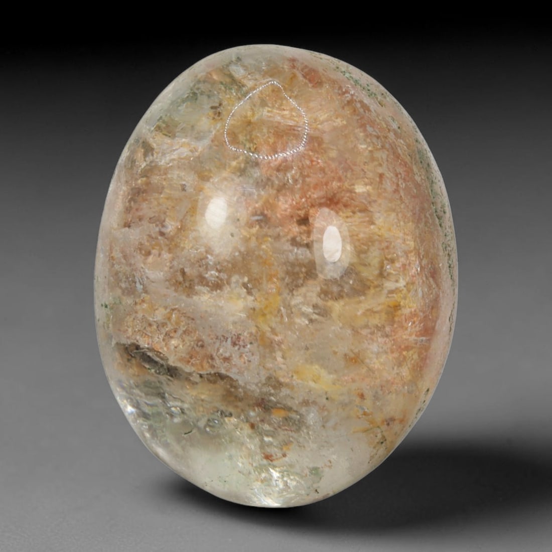 25ct Natural Brazilian Phantom Quartz Oval Cabochon Loose Gemstone, 8BM: This smoothly polished cabochon of natural phantom quartz preserves delicate layered phantom crystal formations enclosed inside transparent quartz host. The domed polished surface offers unobstructed 
