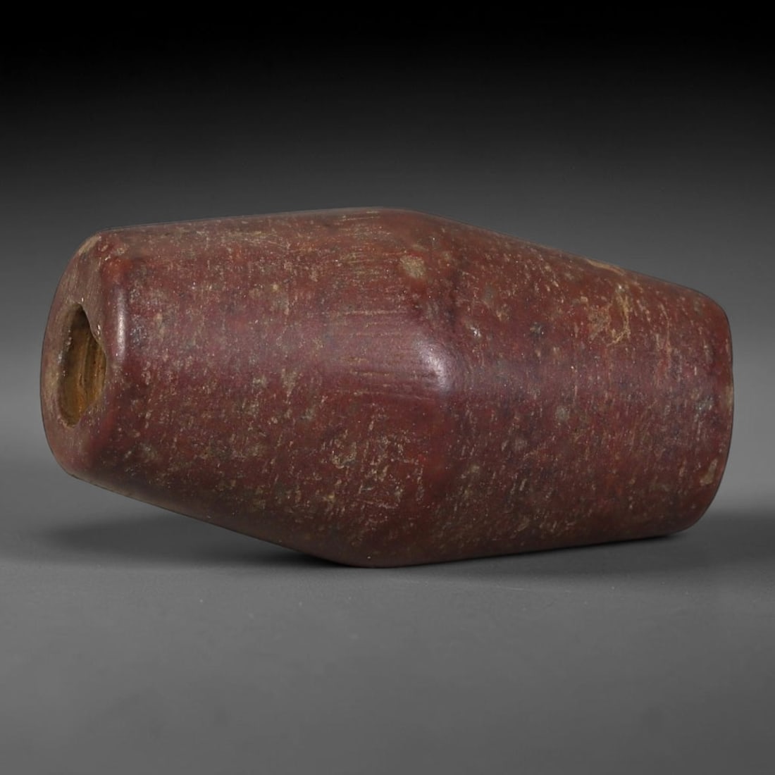 Ancient Indus Valley / Harappan Civilization Red Agate Barrel Trade Bead (2600-1900 BCE), 92AT: This antique tapered barrel red agate bead originates from the Indus Valley / Harappan Civilization, the ancient global hub for standardized etched and polished chalcedony bead production traded widel