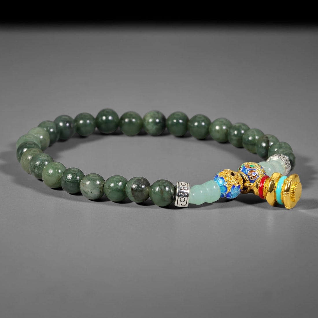 Natural Burmese Type A Jadeite Jade Mala Beaded Bracelet, 14FJ: Constructed from smooth polished natural jadeite jade round beads paired with ornate enameled metal and decorative stone accent components. Uniform 6mm beads form a flexible wearable strand inspired b