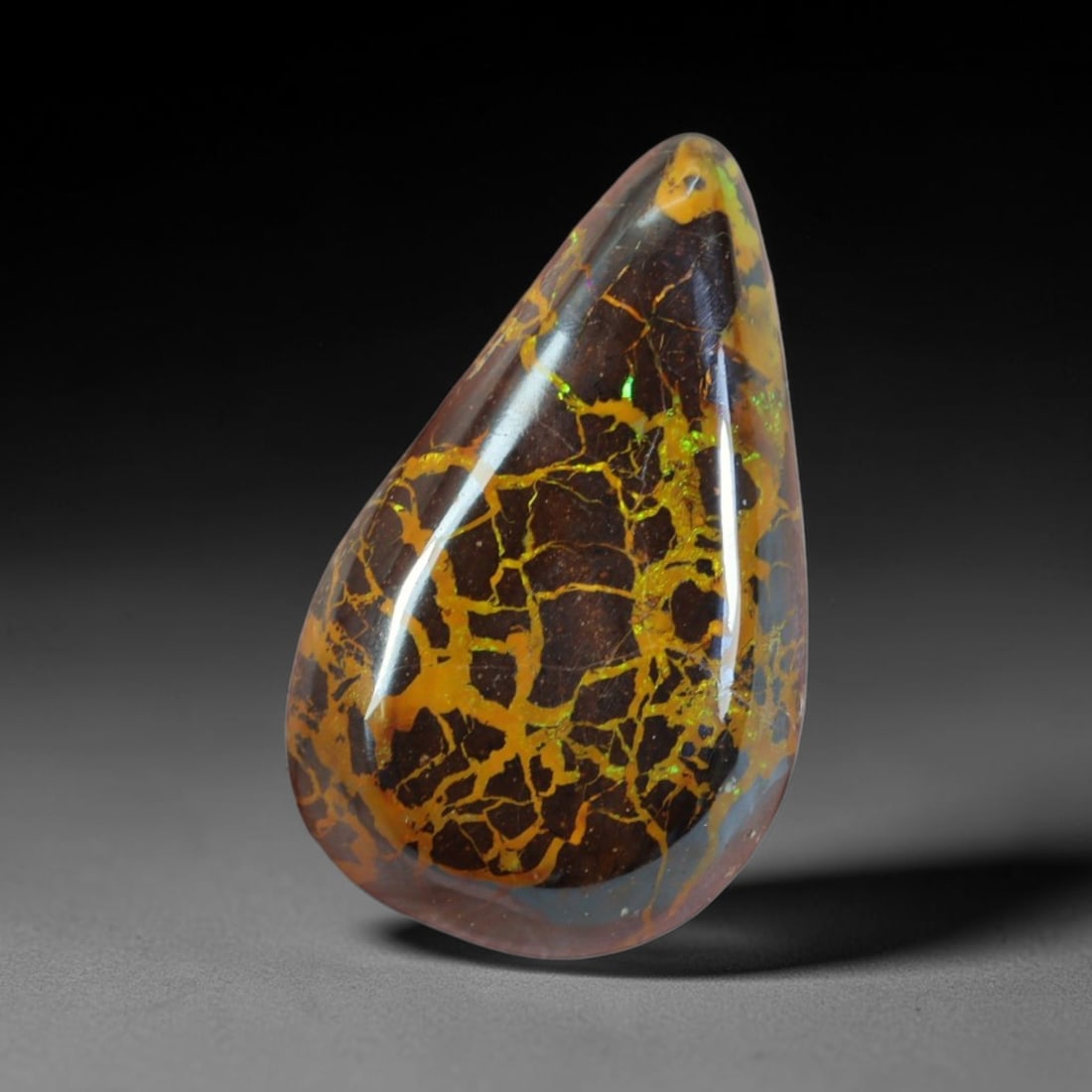 14.60ct Natural Australian Queensland Matrix Boulder Opal Cabochon, 75AT: This hand-polished pear teardrop cabochon is natural Queensland matrix boulder opal, built upon dark ironstone host rock crisscrossed with intricate branching golden opal veining scattered with bright