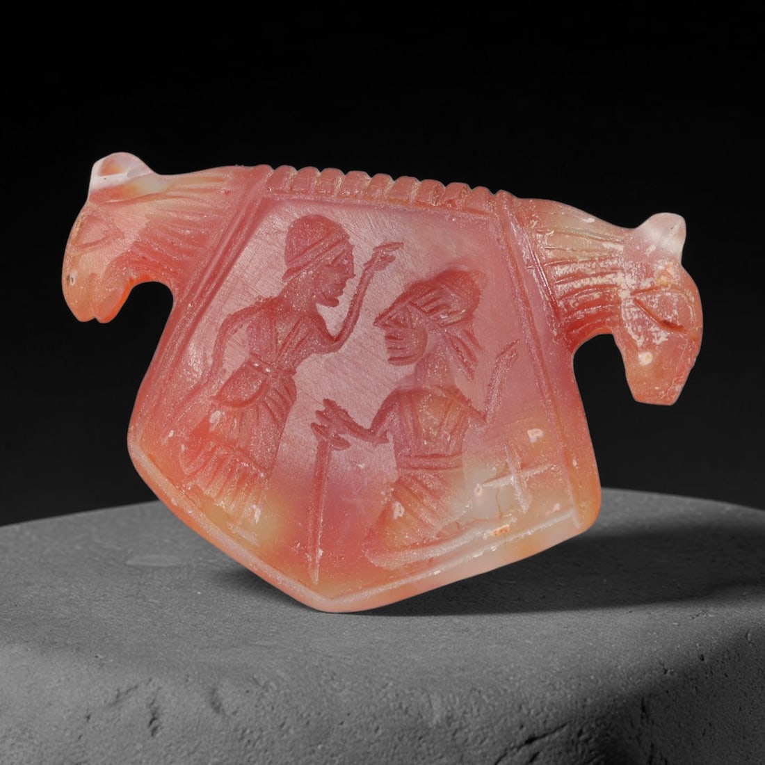 Vintage Natural Carnelian Agate Revival Indo-Persian Glyptic Figural Talisman Amulet Plaque, 73FK: This vintage talisman pendant plaque is skillfully carved from natural banded carnelian agate, crafted in a style referencing ancient Indo-Persian glyptic art traditions. The face bears detailed relie