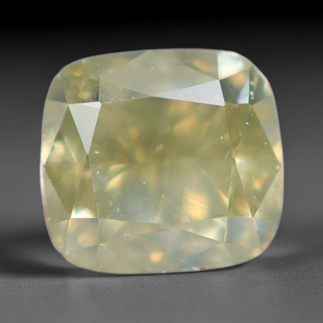 0.42ct Natural Untreated Fancy Greenish Yellow Diamond Loose Gemstone, 18BG: This polished natural diamond carries soft greenish-yellow body tone, with subtle microscopic mineral markings distributed throughout its crystalline interior, measured at calibrated dimensions of 4x3