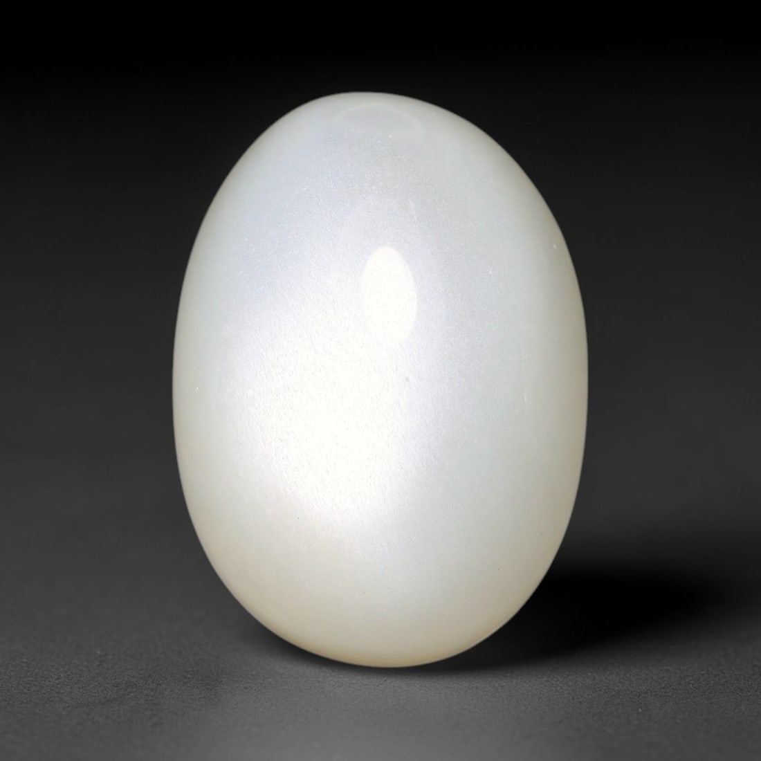 14.36ct Natural Ceylon White Moonstone Cabochon Loose Gemstone, 2FY: This natural Ceylon moonstone cabochon carries a milky white body showcasing classic adularescence. Fine mineral inclusions are visible within the gem. Dimensions measure 16x12x9mm, mined in Sri Lanka