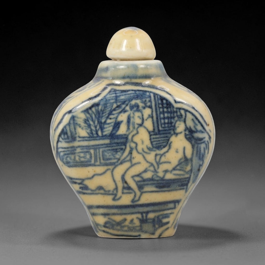 A Chinese Blue and White Porcelain Snuff Bottle, 8ED: Crafted from porcelain, this traditional Chinese snuff bottle features decorative blue painted detailing against an off-white ceramic base. Complete with matching fitted stopper, dimensions measure 6.
