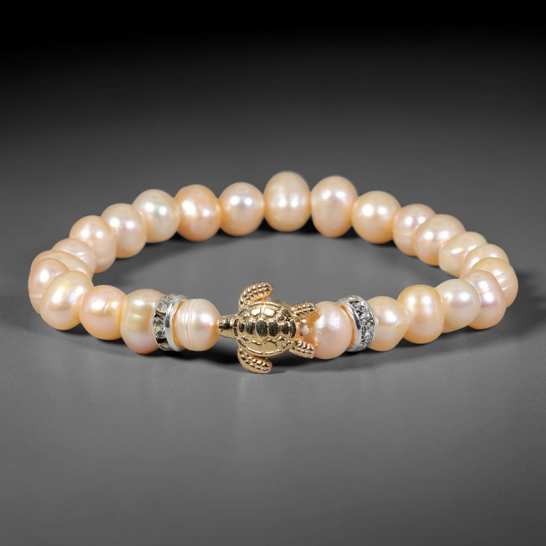 Natural Freshwater Pearl Stretch Bracelet with Gold Tone Crystal Spacers, 92FV: Beautiful stretch bracelet made with 7mm natural freshwater pearls paired with polished gold-toned crystal spacer accents. These organic pearls carry gentle natural luster, strung on flexible elastic 