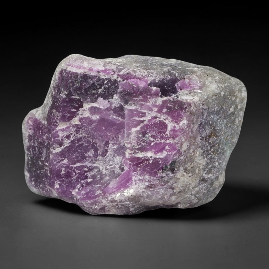 53.68ct Natural Mauritania Ruby Rough (Unheated), 55AT: Natural unheated corundum rough mined from Mauritanian gem-bearing strata, forming a substantial rounded block specimen dominated by expansive saturated magenta-pink ruby corundum crystalline clusters