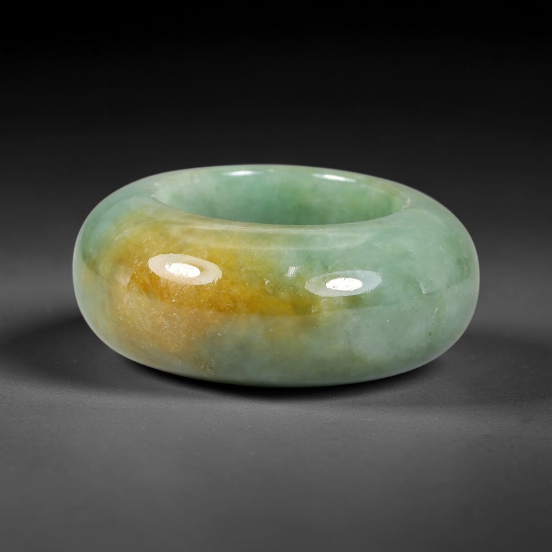 Natural Burmese Type A Jadeite Jade Wide Band Ring, 26BK: Polished untreated Burmese Type A jadeite jade wide band ring, US ring size 13 with a substantial band width of 15 mm. The jadeite features a soft pale mint green base naturally streaked with flowing 