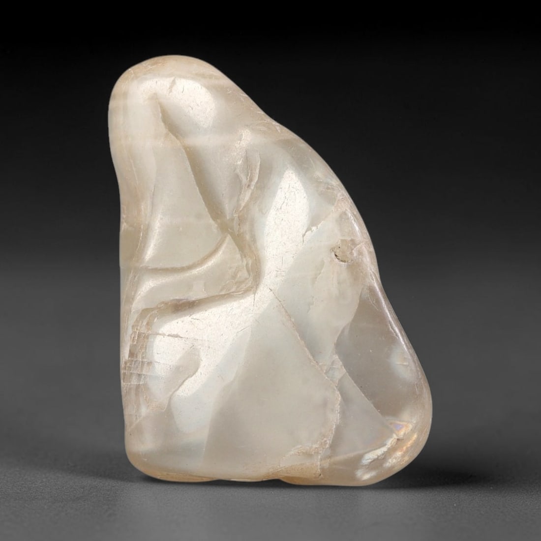 36ct Natural Ceylon Pale Cream White Moonstone Rough, 72AH: This smooth weathered moonstone rough carries soft pale cream white translucency with subtle internal silvery adularescent shimmer locked within its naturally tumbled surface, fine faint mineral veini