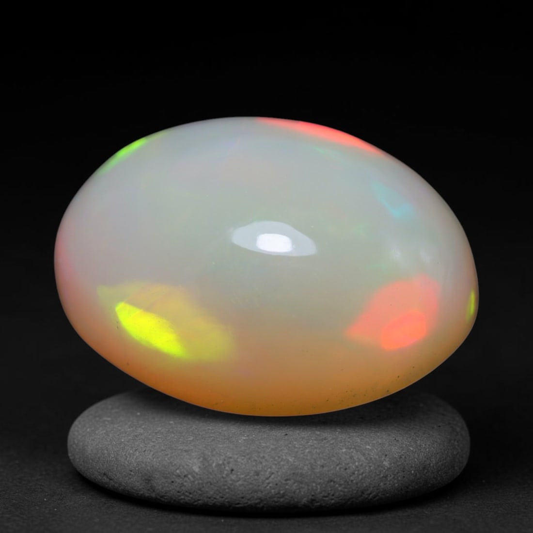 4.80ct Natural Ethiopian Welo Opal Cabochon Loose Gemstone, 22BY: This smoothly polished cabochon is genuine natural Ethiopian Welo opal. The translucent base hosts vivid multi-coloured play-of-colour, displaying dynamic flashes of multi color that shift as the view