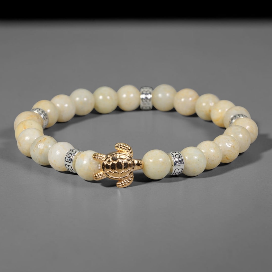 Natural Burmese Type A Jadeite Jade Beaded Bracelet, 26FJ: Crafted from polished natural jadeite jade round beads with soft creamy and pale natural tones. Each bead measures 8mm, arranged into a flexible wearable strand. Clean and elegant, this bracelet is su