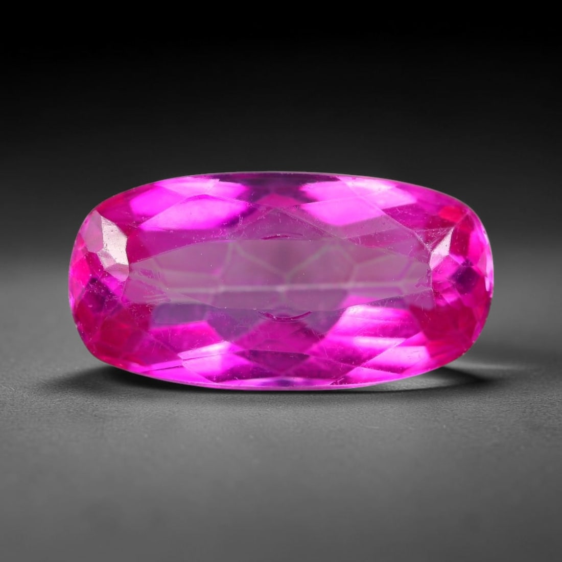 8.06 Carats Natural Brazil Hot Pink Topaz Loose Gemstone, 18FE: This natural Brazil topaz holds dimension measurements of 16.6x8.5x6.3mm, displaying an intense vibrant hot pink shade created through surface color coating treatment, its transparent crystal body car