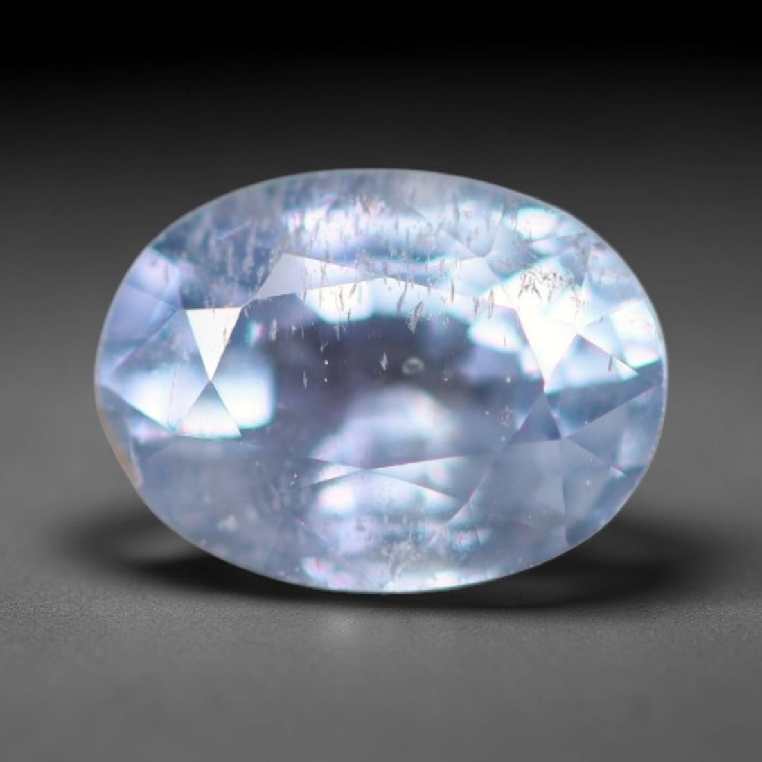 0.66ct Natural Ceylon Pale Lavender Blue Faceted Blue Sapphire Loose Gemstone, 39BC: This skillfully faceted Ceylon blue sapphire holds a soft pale lavender-blue translucent body tone, filled with signature fine needle-like mineral silk inclusions native to Sri Lankan sapphire deposit