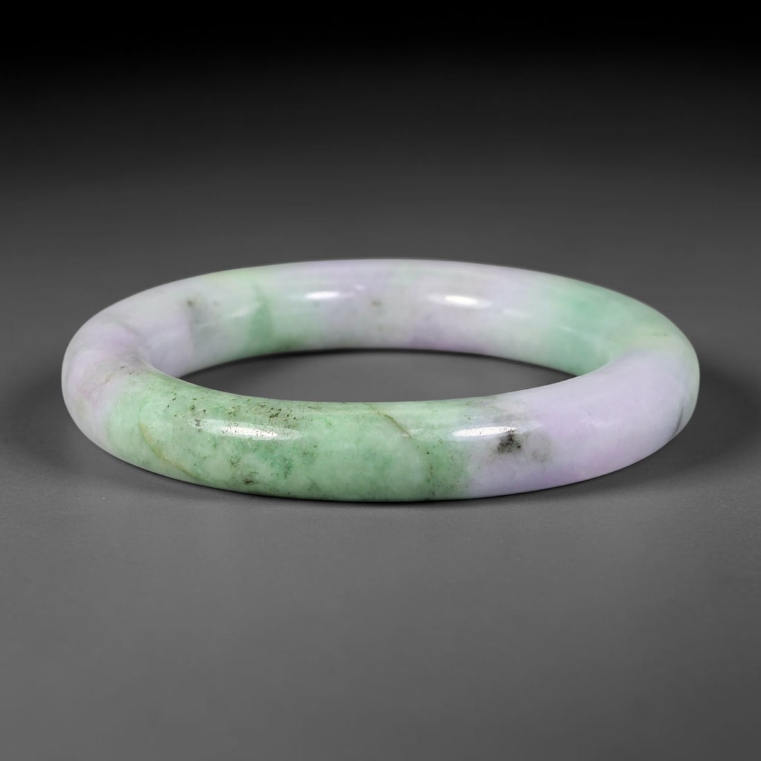 Natural Burmese Type A Jadeite Jade Bangle Bracelet, 73BK: Polished untreated Burmese Type A jadeite jade bangle bracelet with a 57 mm inner diameter and a 12 mm band width. Crafted into a classic rounded interior flat exterior shape with smooth continuous hi