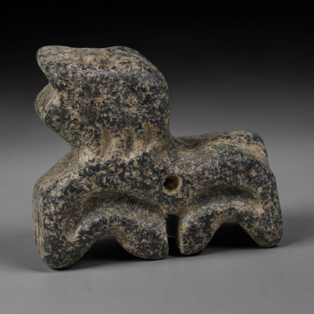 Ancient Bactrian Hand Carved Schist Stone Protective Amulet, 94AP: Miniature antique wearable talisman hand hewn from natural speckled schist metamorphic stone, originating from ancient Bactrian Central Asian cultural sphere. Schist was a prominent carving material i