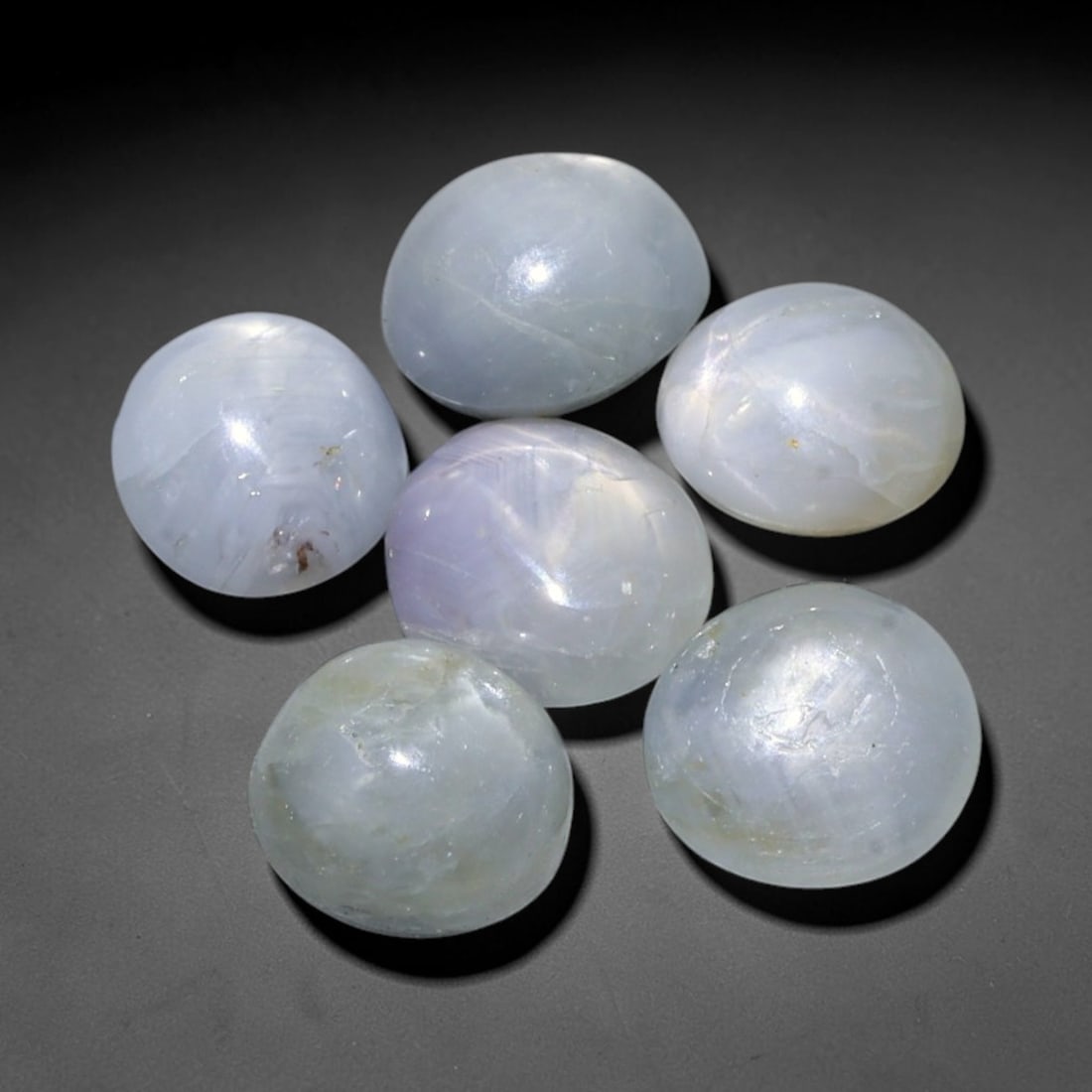 8.45ct Natural Unheated Burmese Star Sapphire Loose Gemstone Parcel, 95FL: This parcel contains natural unheated star sapphire originating from Myanmar. The gem material displays soft pale blue and lavender hues, with characteristic silk inclusions that create the desirable 