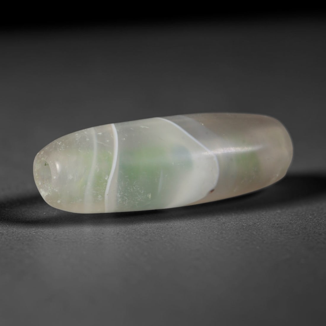 Ancient Medieval Chagatai Khanate Central Asian Banded Agate Barrel Bead (1226-1680 CE), 46AD: This antique banded agate barrel bead originates from the Chagatai Khanate Central Asian Culture, a long-standing Silk Road production hub that sustained agate bead manufacturing for Islamic prayer be