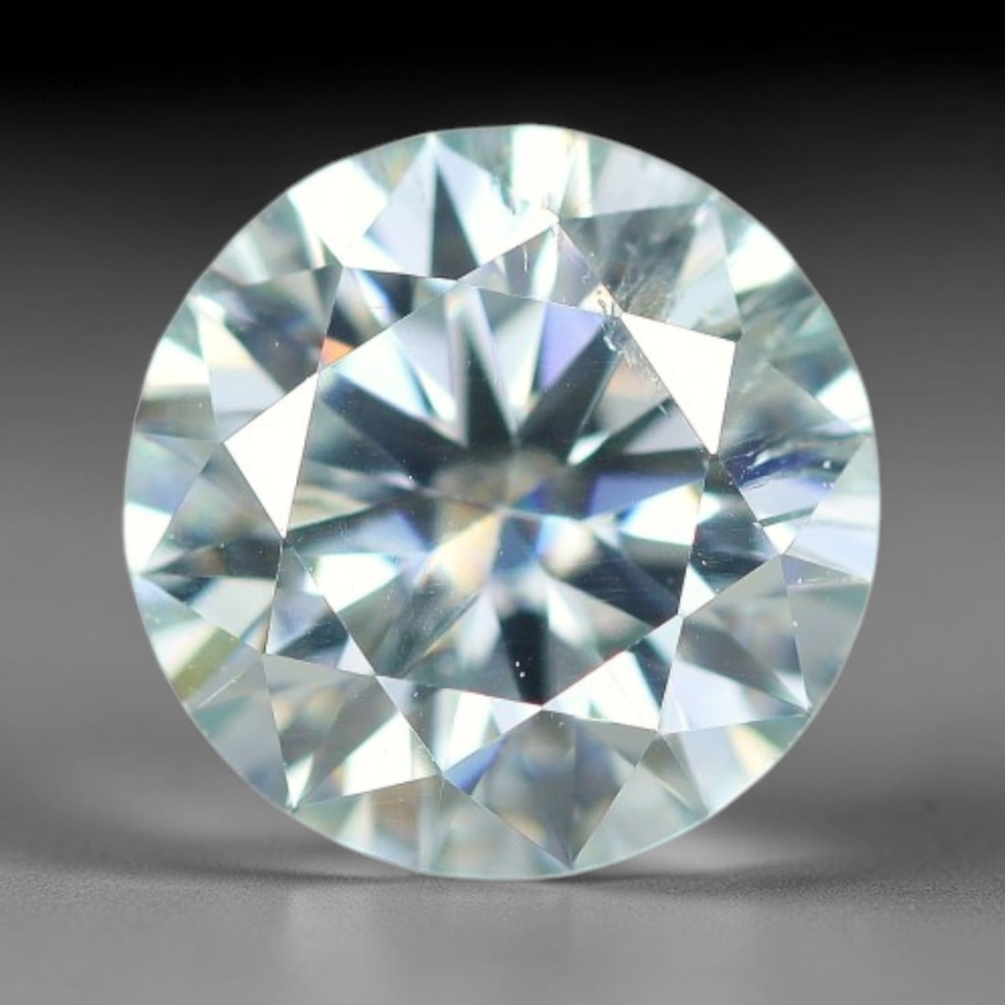 0.95 Carats Natural Light Blue Moissanite Loose Gemstone, 26FP: This lab-grown light blue moissanite features dimensions of 6.5x3.9mm, crafted from silicon carbide renowned for superior refractive index that delivers intense rainbow sparkle under all light sources