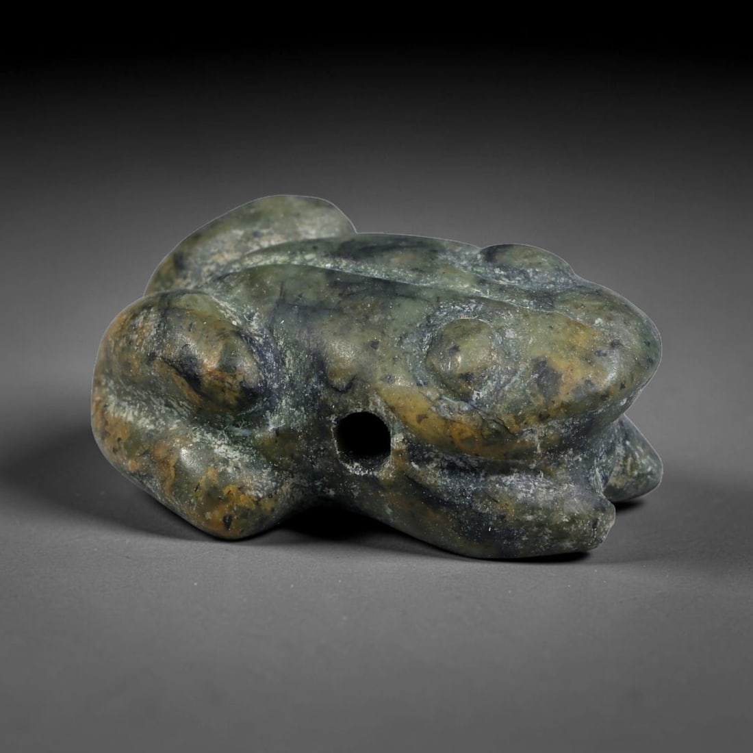 Ancient Sasanian Persian Empire Mottled Green Stone Frog Amulet (224-651 CE), 42EC: This carved mottled green stone frog amulet originates from the Sasanian Persian Empire, where frog zoomorphic talismans symbolised fertility, renewal and water spirits, valued as portable protective 