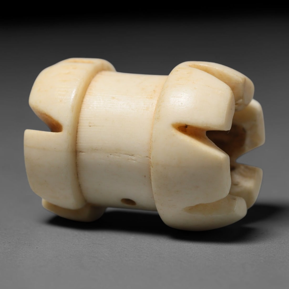 Antique Sino-Siberian Steppe Nomadic Craft Stag Antler Carved Cylinder Bead (Post 1850s), 8FV: Single bead carved from natural stag antler, originating from Sino-Siberian Steppe Nomadic craft traditions, post 1850s. Measuring 2cm, the piece features detailed surface carving and carries warm nat