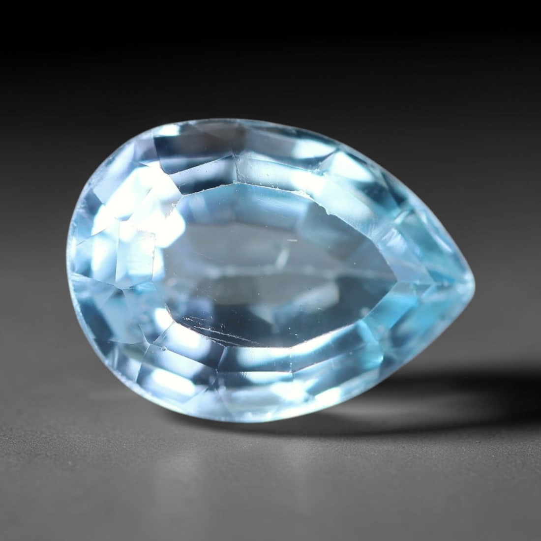 3.77ct Natural Brazilian Sky Blue Topaz Loose Gemstone, 54BE: This fully polished topaz exhibits clean bright sky-blue body tone, with faint microscopic natural crystal features visible inside its transparent structure, measured at calibrated dimensions of 11.1x