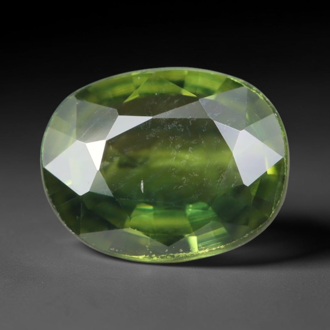 1.06ct Natural Australian Parti Sapphire Faceted Loose Gemstone, 66BA: This expertly faceted Australian parti sapphire features blended multi-tonal green-yellow internal saturation with tiny scattered microscopic mineral specks suspended within its transparent crystallin