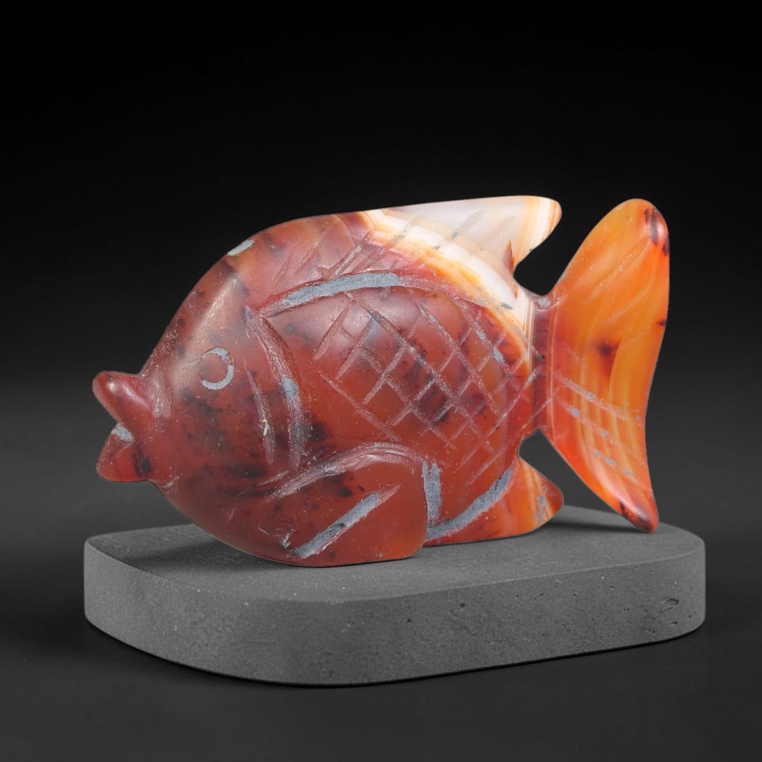 Ancient Medieval Mughal Indian Culture Carnelian Carved Figurine (1526-1857 CE), 3EC: This antique carved carnelian ornament originates from Mughal Indian craft traditions, where colourful chalcedony was regularly shaped into decorative talismans and adornments for elite patrons and re