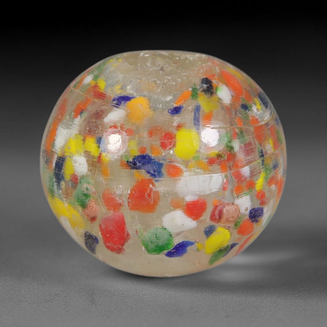Multi-Color Confetti Blown Glass Bead - Handmade Vintage Spherical Ornament, 24AE: Hand-blown translucent clear glass forms this spherical bead, filled with scattered fragmented confetti flecks of red, yellow, blue, green, orange and white glass suspended evenly through the glass ma