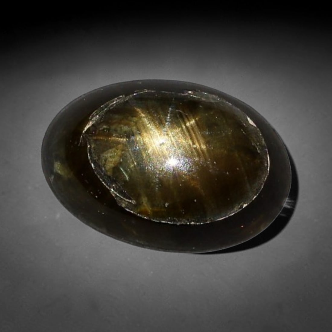 1.61ct Natural Siamese 6-Ray Black Star Sapphire Loose Gemstone, 55BX: This polished star sapphire originates from classic Siamese mining deposits, featuring a deep dark crystalline base with fine native mineral traces trapped within its structure, sized at calibrated 7x